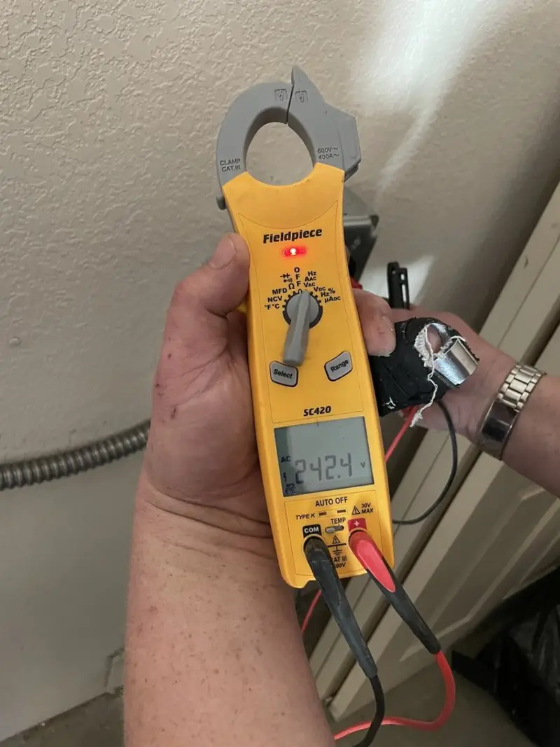 Voltage testing with clamp meter during Whole House Surge Protector in Bristow